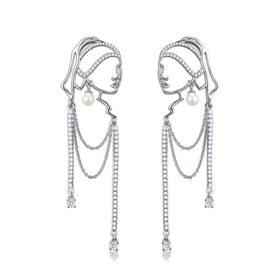 Chica con aretes de perlas