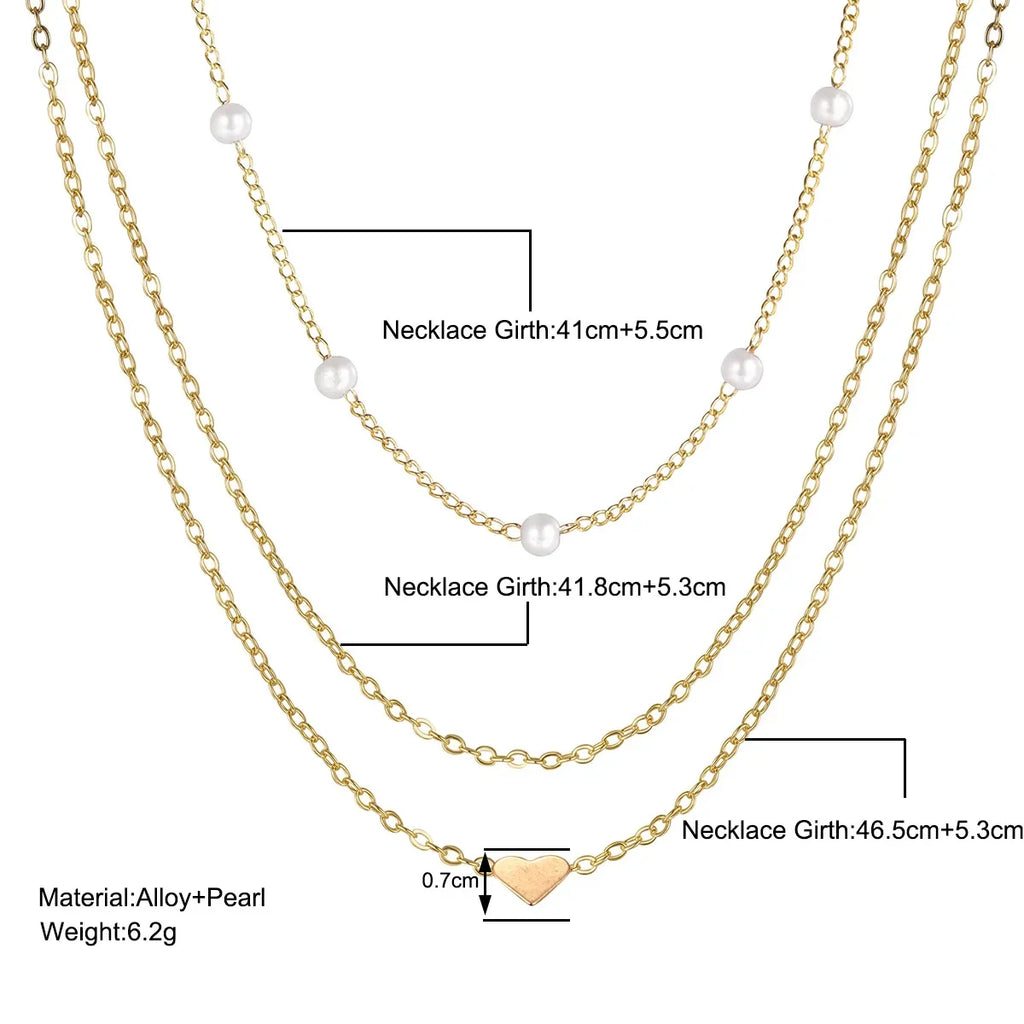 Collares multicapas con colgante de corazón y cruz de perlas