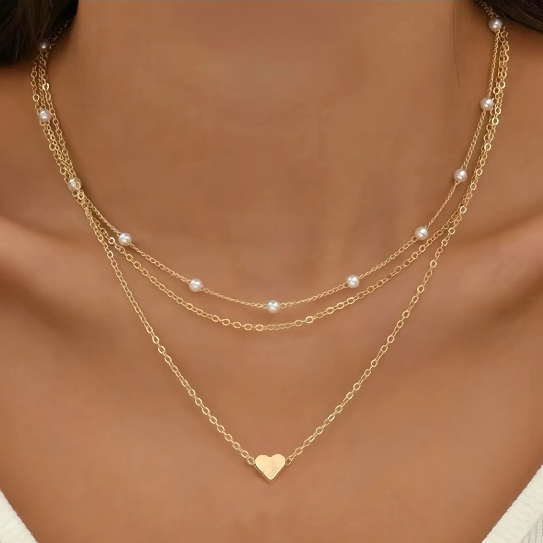 Collares multicapas con colgante de corazón y cruz de perlas