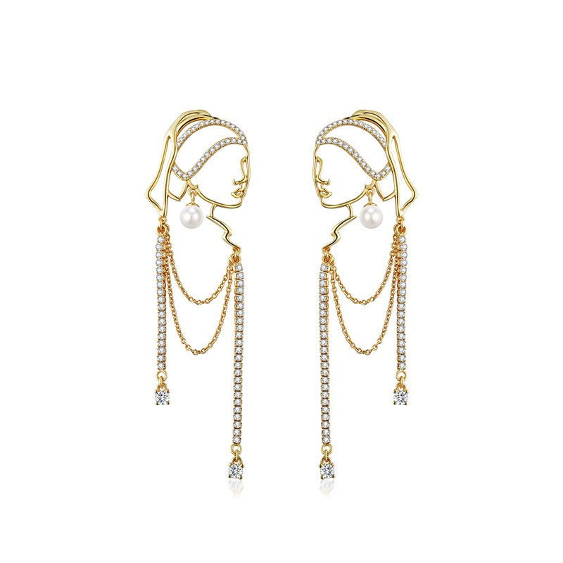 Chica con aretes de perlas