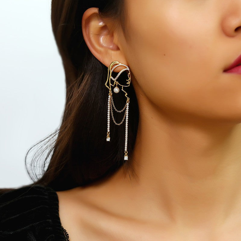 Chica con aretes de perlas